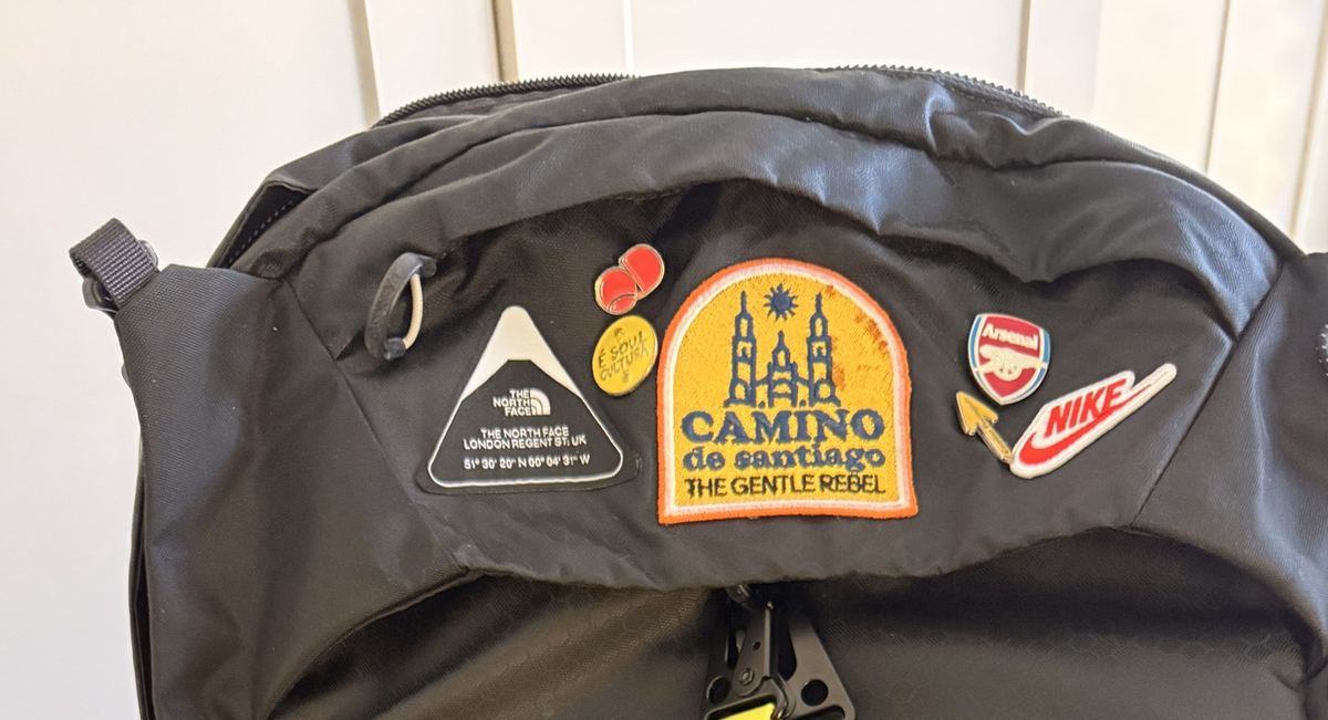 Gentle Rebel patches on a well-travelled backpack