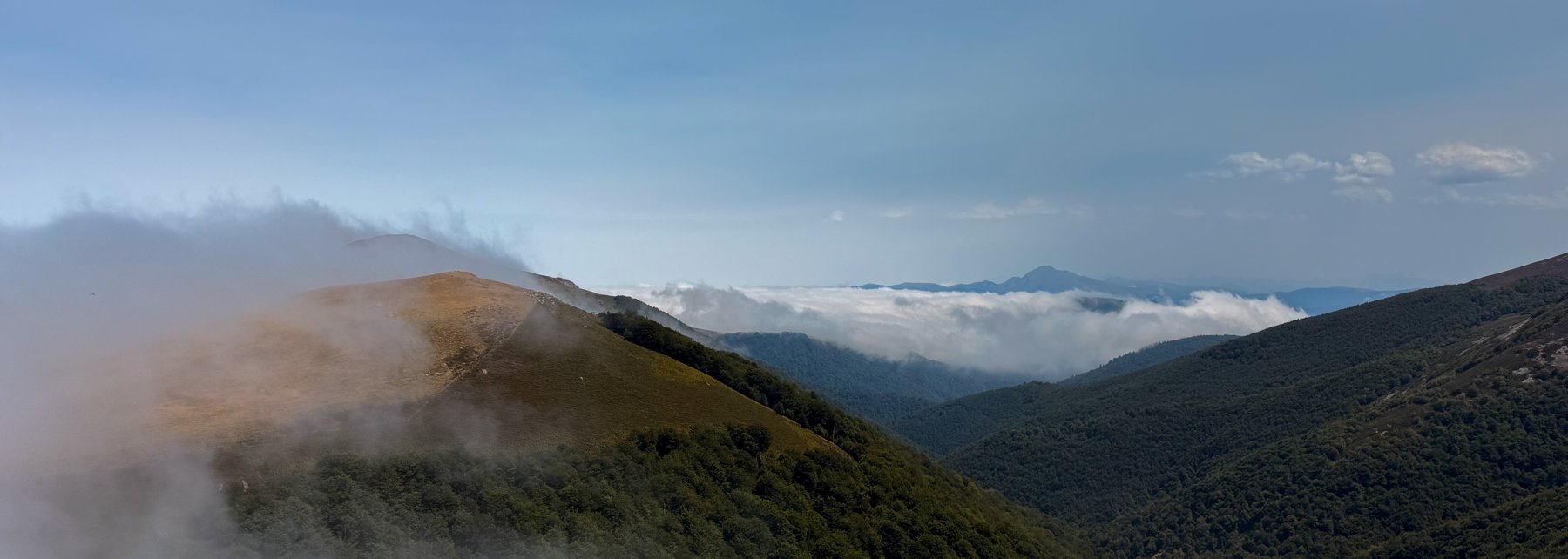 Misty mountain ridge above a sea of clouds, Camino de Santiago
